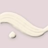 Lait solaire satiné à l'huile de tamanu SPF 50+ – Ambre Sépia, aperçu de la texture